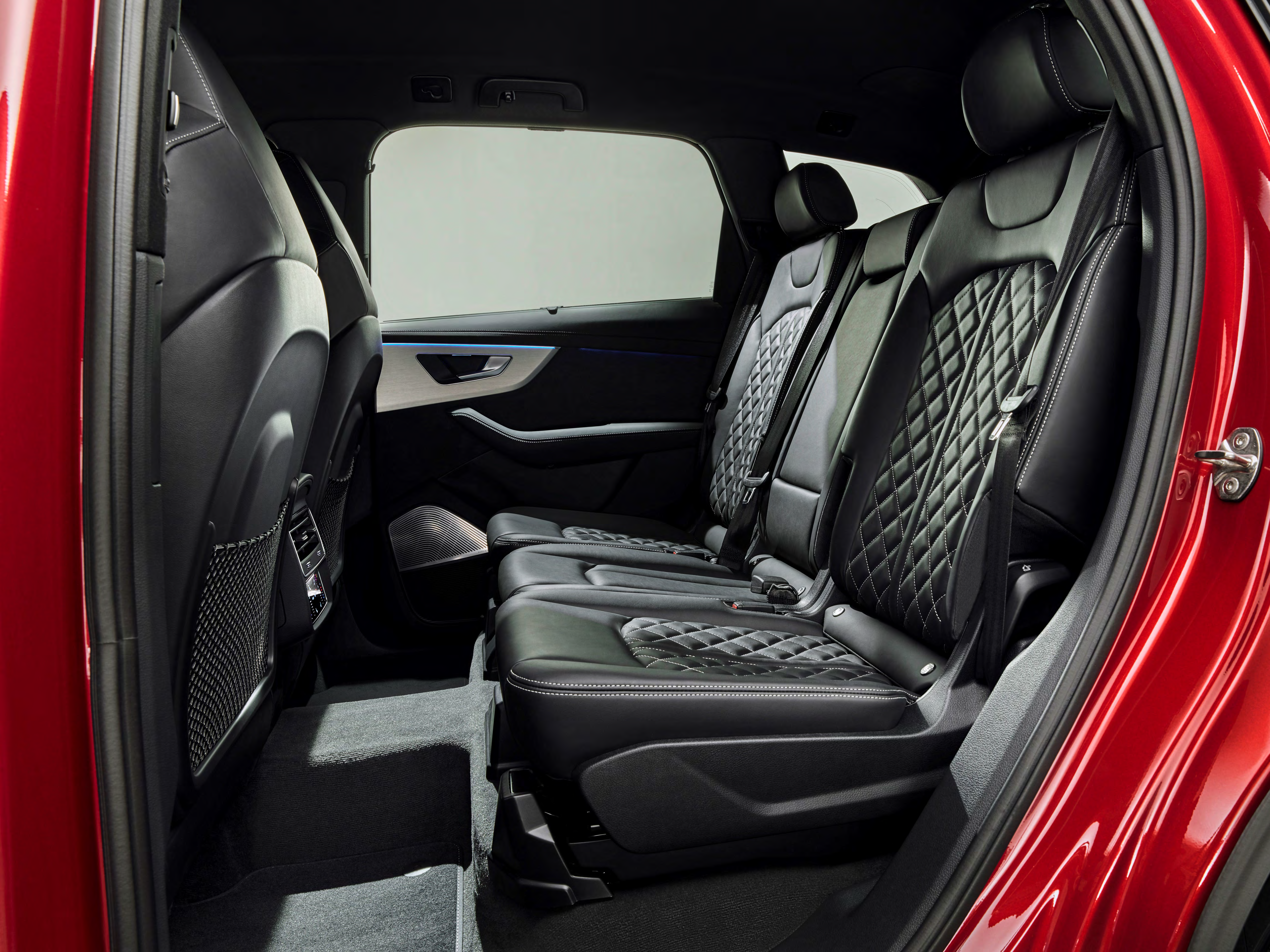 Audi Q7 — Rear bench with diamond-quilted leather upholstery and ambient light strip