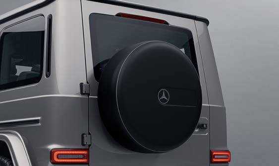 Mercedes-Benz G-Class — Body-mounted spare wheel on the side-hinged tailgate, finished with a hard cover carrying the Mercedes-Benz star
