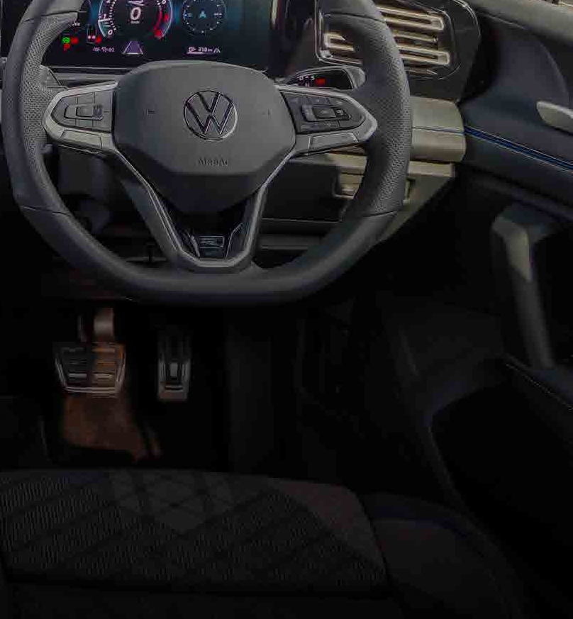 Volkswagen Tiguan R-Line — Leather-wrapped multifunction R sports steering wheel with paddle shifters ahead of the 10.25-inch Digital Cockpit Pro