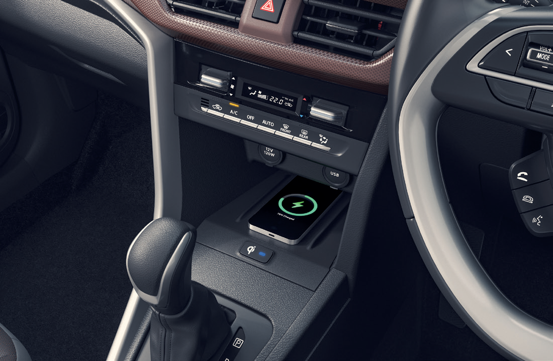 Maruti Suzuki Brezza — Wireless charging dock with 12V and USB outlets.