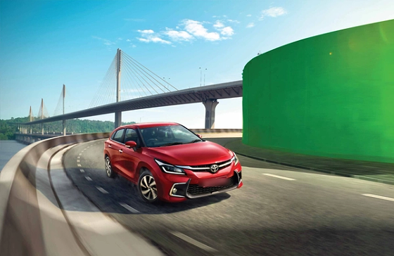 Toyota Glanza (2022-2026), The Glanza on the move, highlighting its planted stance and aerodynamic silhouette.