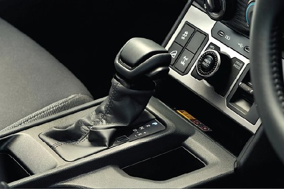 Toyota Hilux, Redesigned cabin with leather-wrapped gear lever and drive-mode/4WD controls.