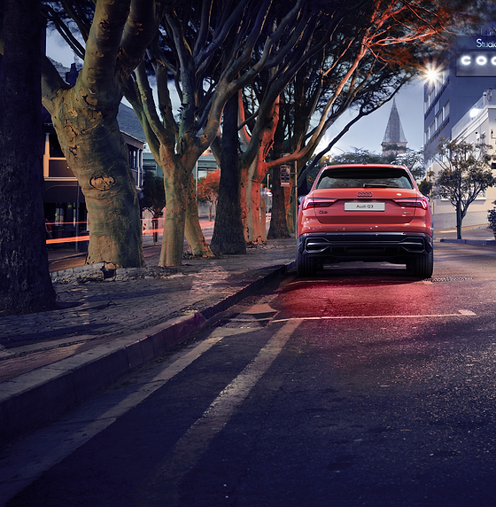 Audi Q3 (2022-2026), LED rear combination lamps illuminated across the tailgate at night.