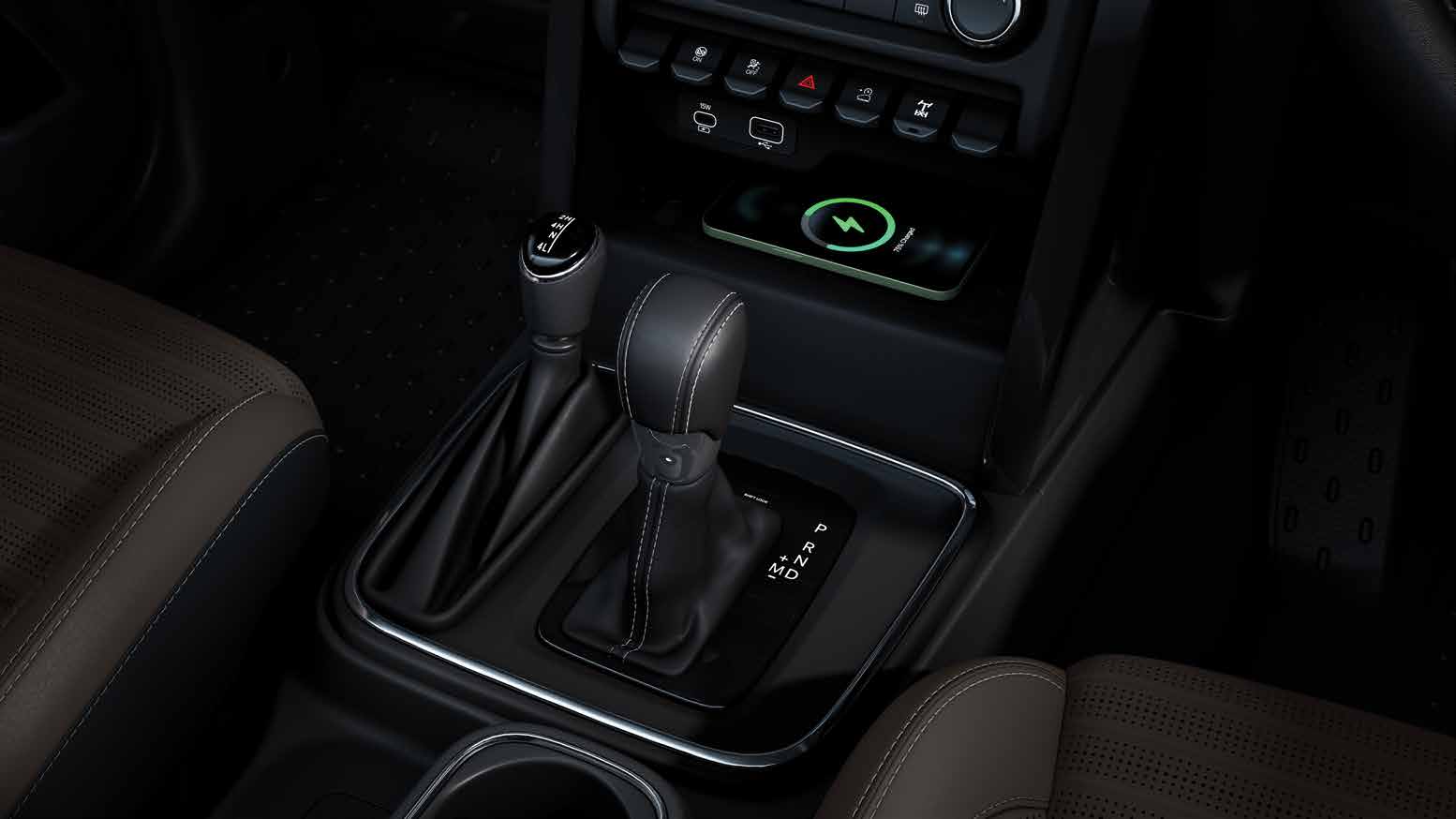 Mahindra Thar OG, Centre console close-up: automatic gear lever with a P R N D M gate, a shorter second lever beside it, a wireless chargi