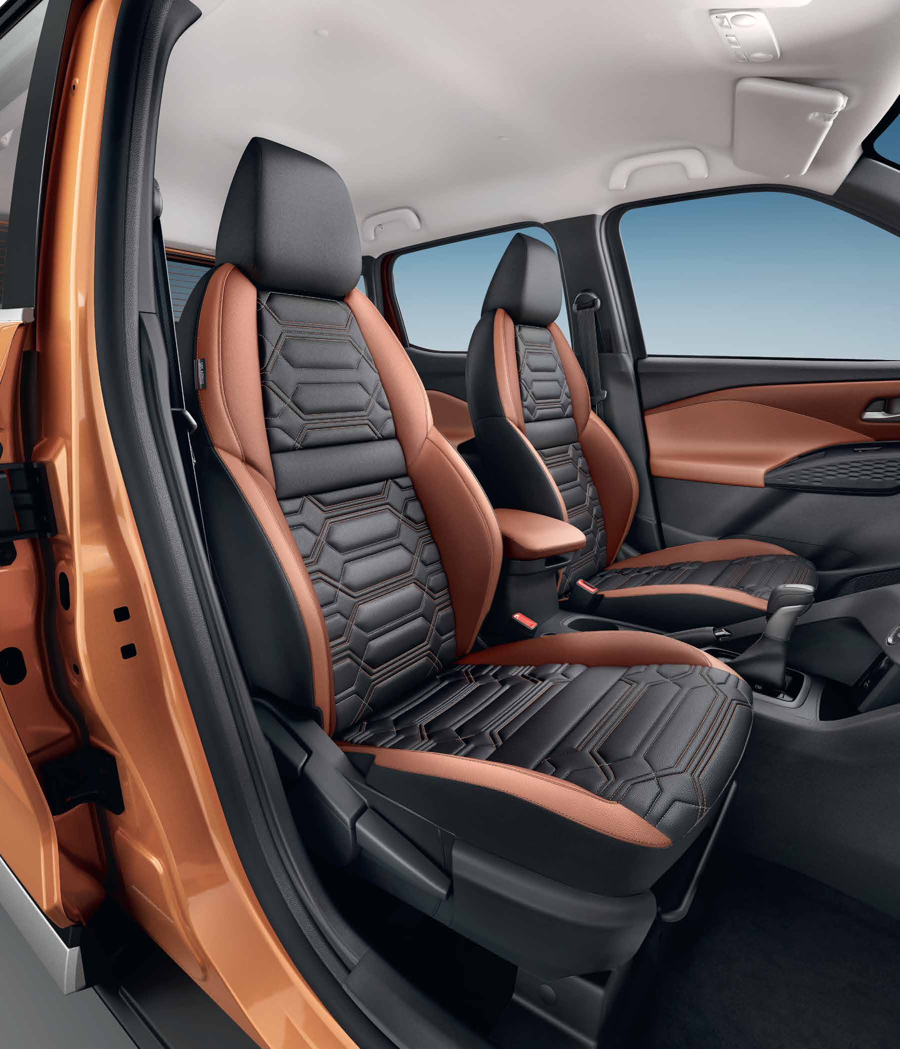 Nissan Magnite — Quilted leatherette front seats with hexagonal pattern and contrast stitching.