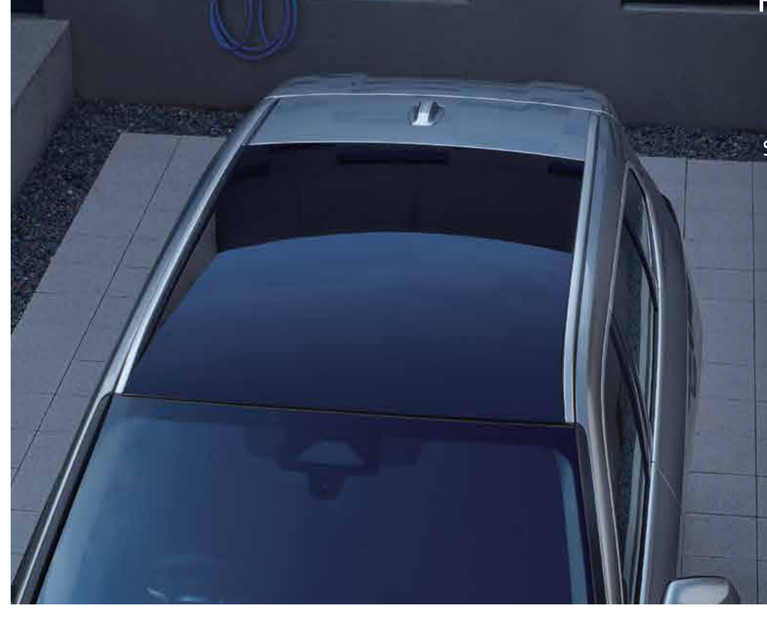 BMW iX1 LWB — Fixed panoramic glass roof spanning the cabin, seen from above