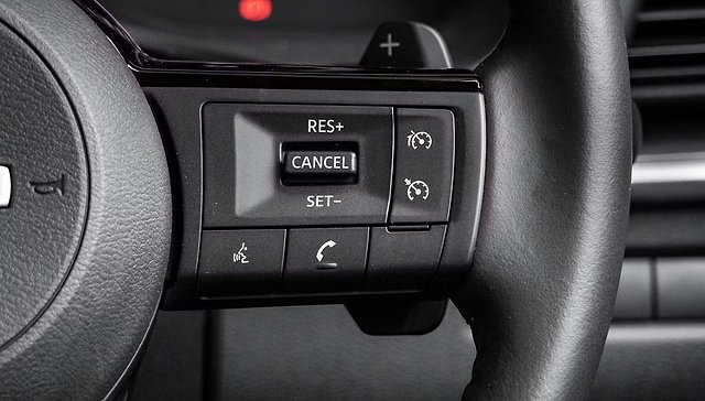 Steering wheel controls showing cruise control buttons: RES+, CANCEL, SET-, and phone functions.