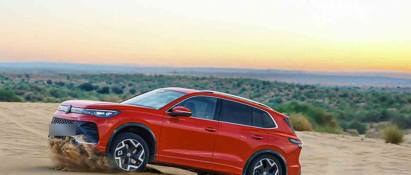 Volkswagen Tiguan R-Line — 4MOTION all-wheel drive powering the R-Line through loose desert sand