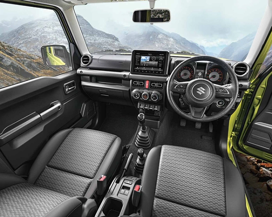 Maruti Suzuki Jimny, Upright dashboard with a floating touchscreen, analogue twin-dial cluster and manual gear lever.