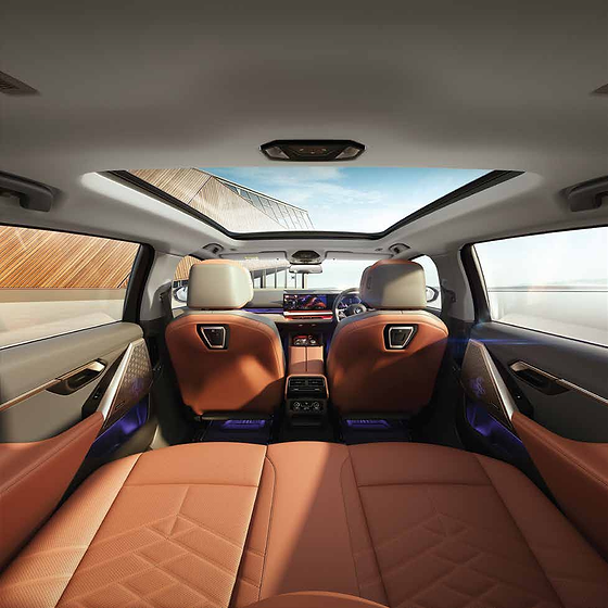 BMW 5 Series , Sculpted front seats beneath the panoramic glassroof, with the wide dashboard display