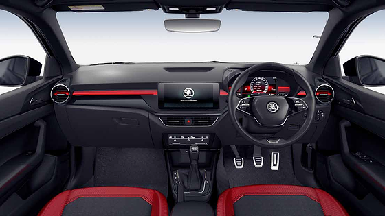 Skoda Škoda Slavia (2022–2026), Monte Carlo cabin with the 20.32 cm Virtual Cockpit red theme, red dashboard accents and aluminium pedals.