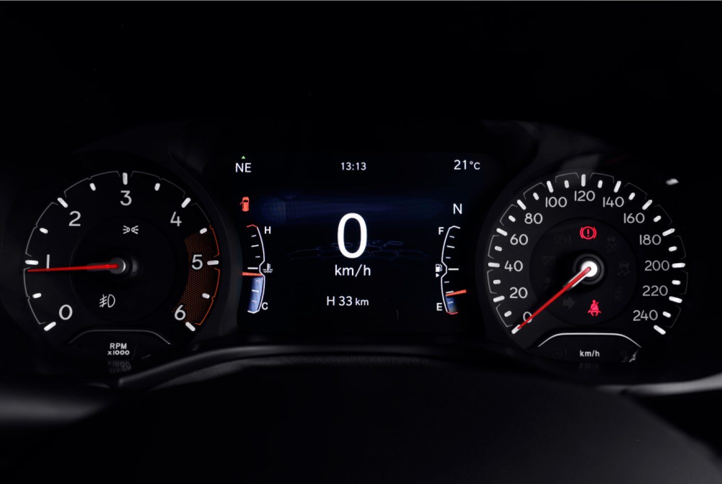 Jeep Meridian — Analogue dials flanking a colour digital driver-information display.
