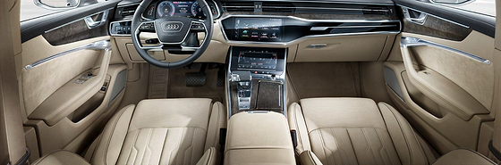 Audi A6, Driver-oriented cabin with beige leather seats, wood inlay and twin displays
