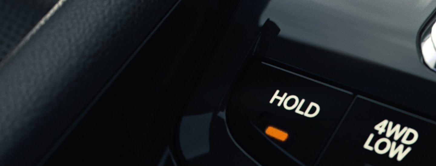 Jeep Compass — Auto-hold and 4WD Low controls for low-speed off-road driving.