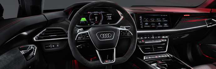 Audi e-tron GT — Flat-bottom Alcantara steering wheel with paddle shifters and the fully digital Audi virtual cockpit