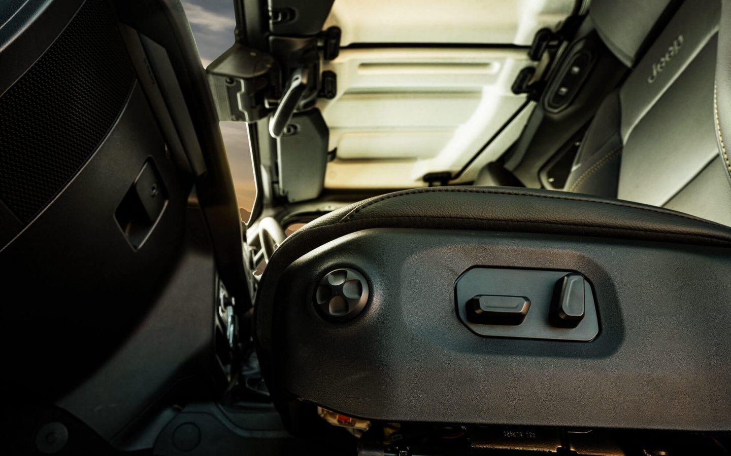 Jeep Wrangler — Power-adjustable front seat with side-mounted seat controls