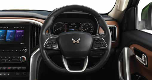 Mahindra Scorpio N — Leather-wrapped multifunction steering wheel with mounted controls ahead of the driver display