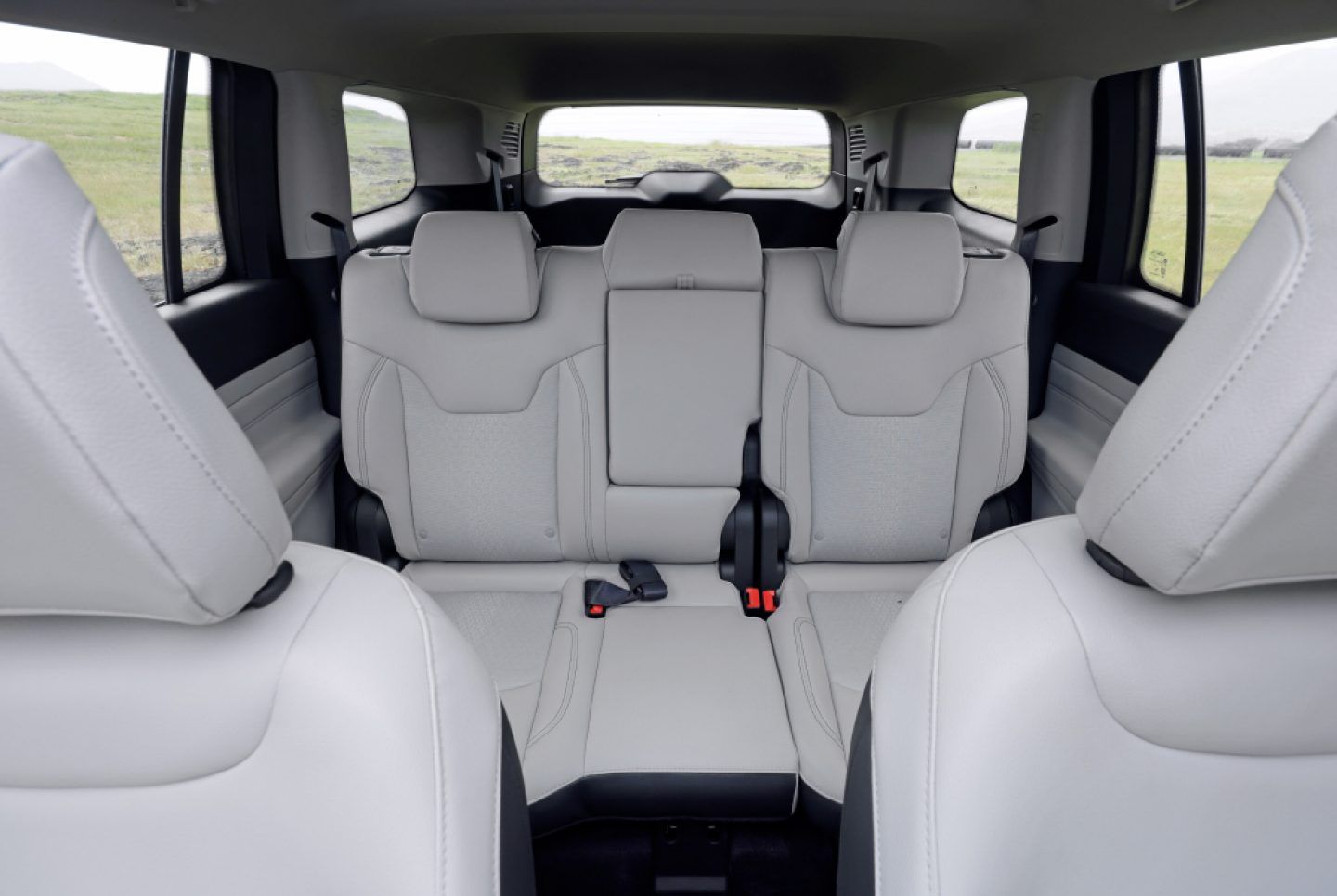 Jeep Meridian — Second-row bench seat finished in light-grey leather upholstery.
