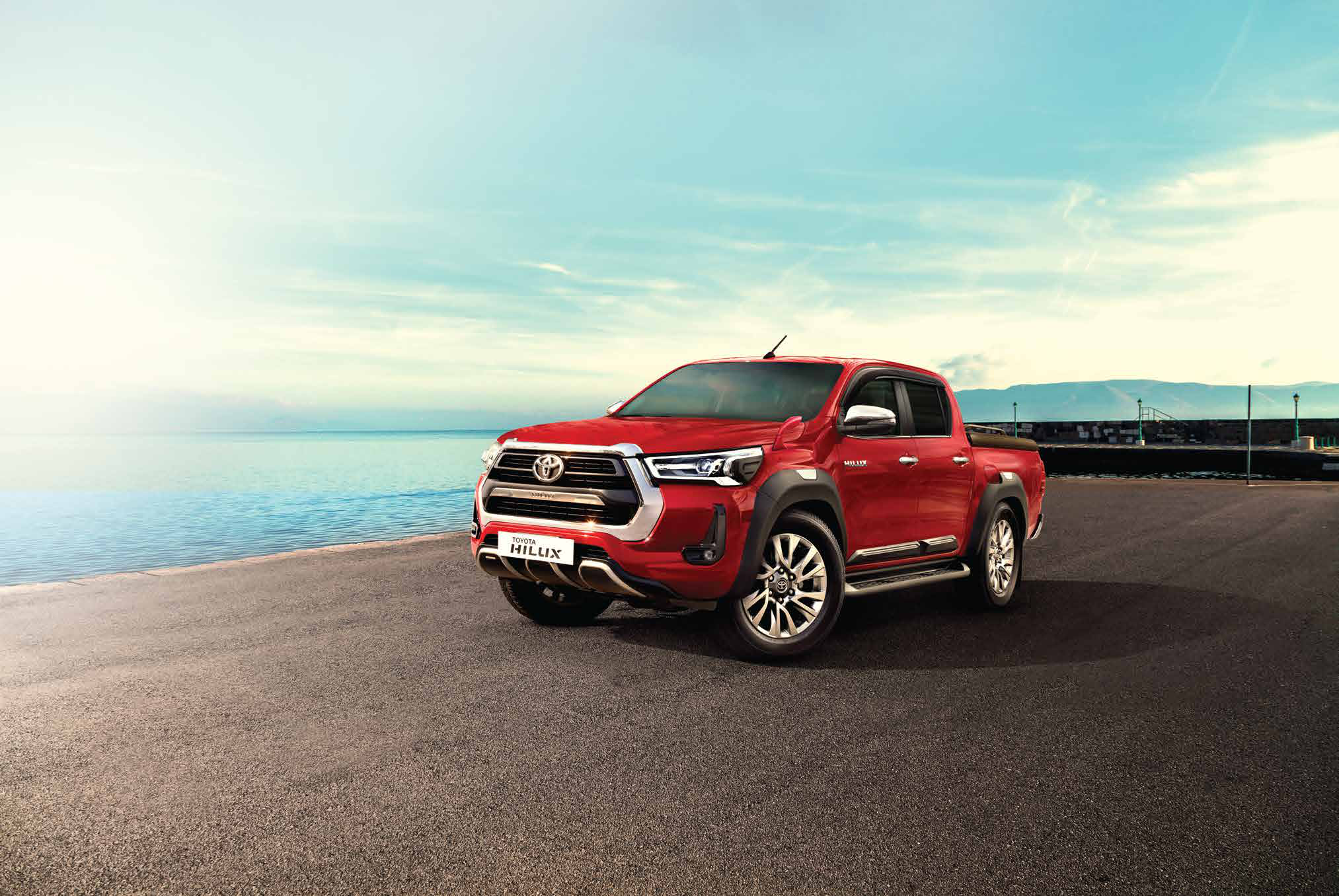 Toyota Hilux — LED headlamps flank the bold chrome front grille of the double-cab Hilux.