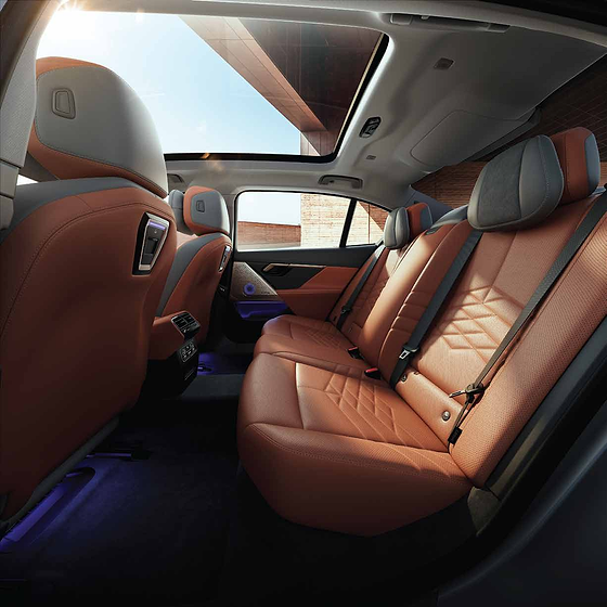 BMW 5 Series , Rear seats in quilted vegan leather beneath the panoramic glassroof, with ambient footwell lighting