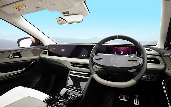 Mahindra XEV 9e, Two-spoke steering wheel with touch controls and an illuminated logo