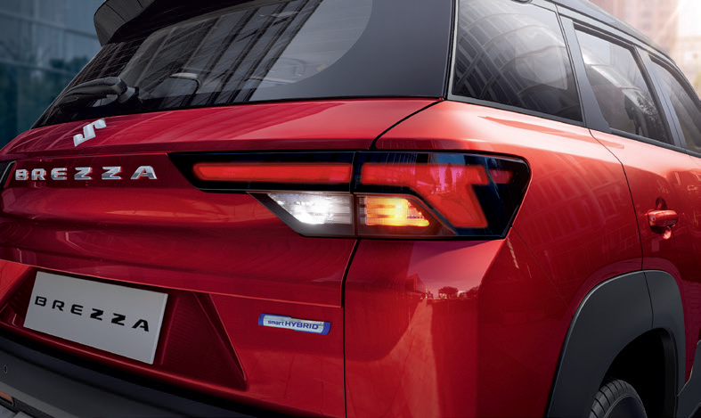 Maruti Suzuki Brezza — LED tail lamps with connected-look signature and Smart Hybrid badge.