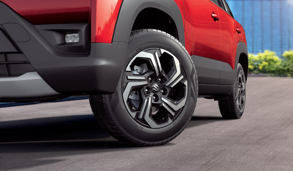 Maruti Suzuki Brezza — Bold geometric dual-tone alloy wheels.