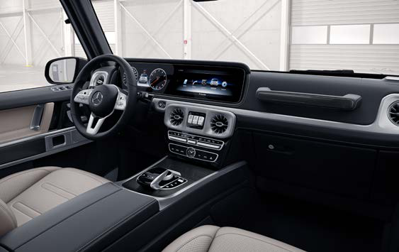 Mercedes-Benz G-Class — Twin 12.3-inch widescreen displays for the instrument cluster and media, set beneath one continuous glass panel