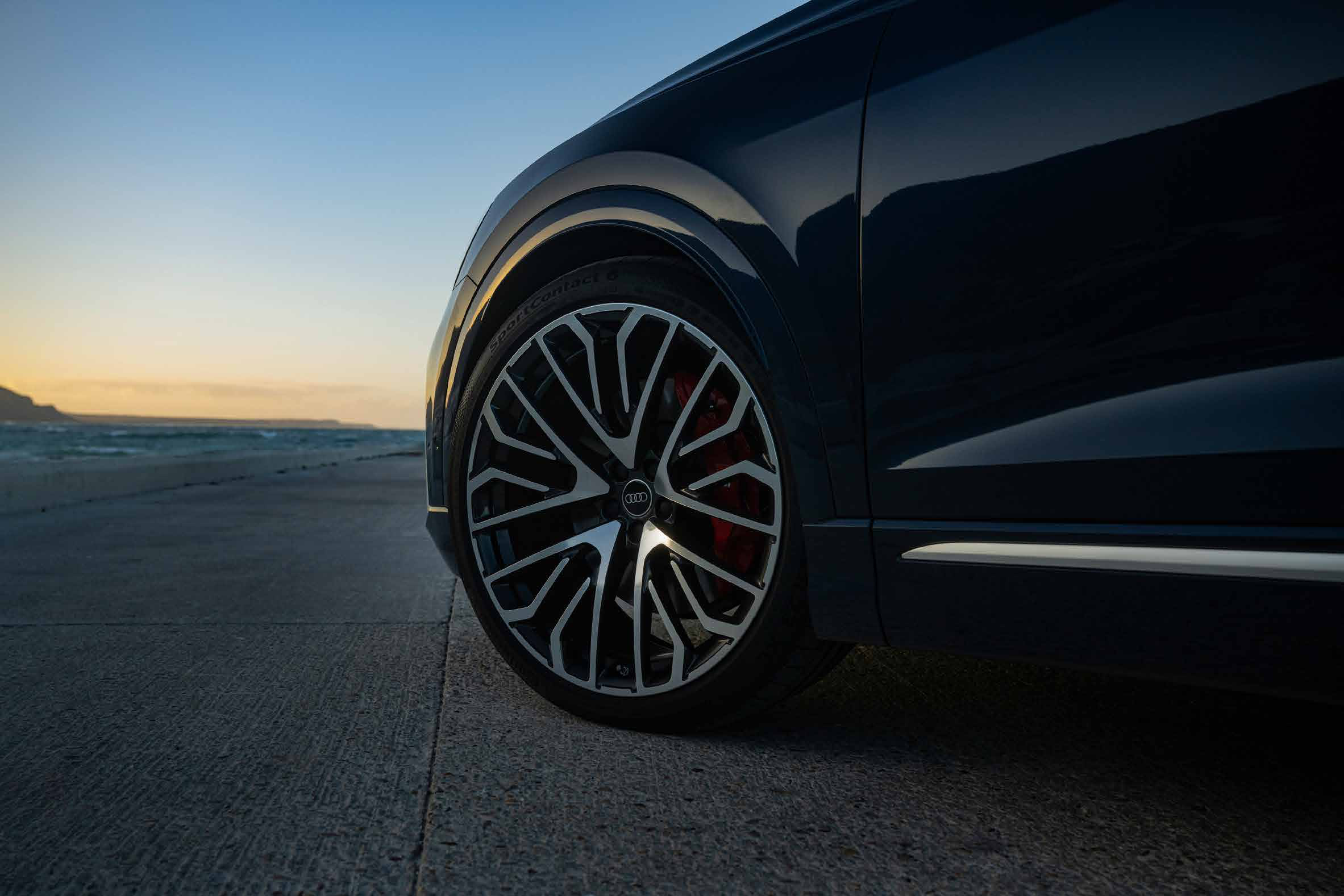 Audi SQ8 — Machined alloy wheels with red brake calipers.