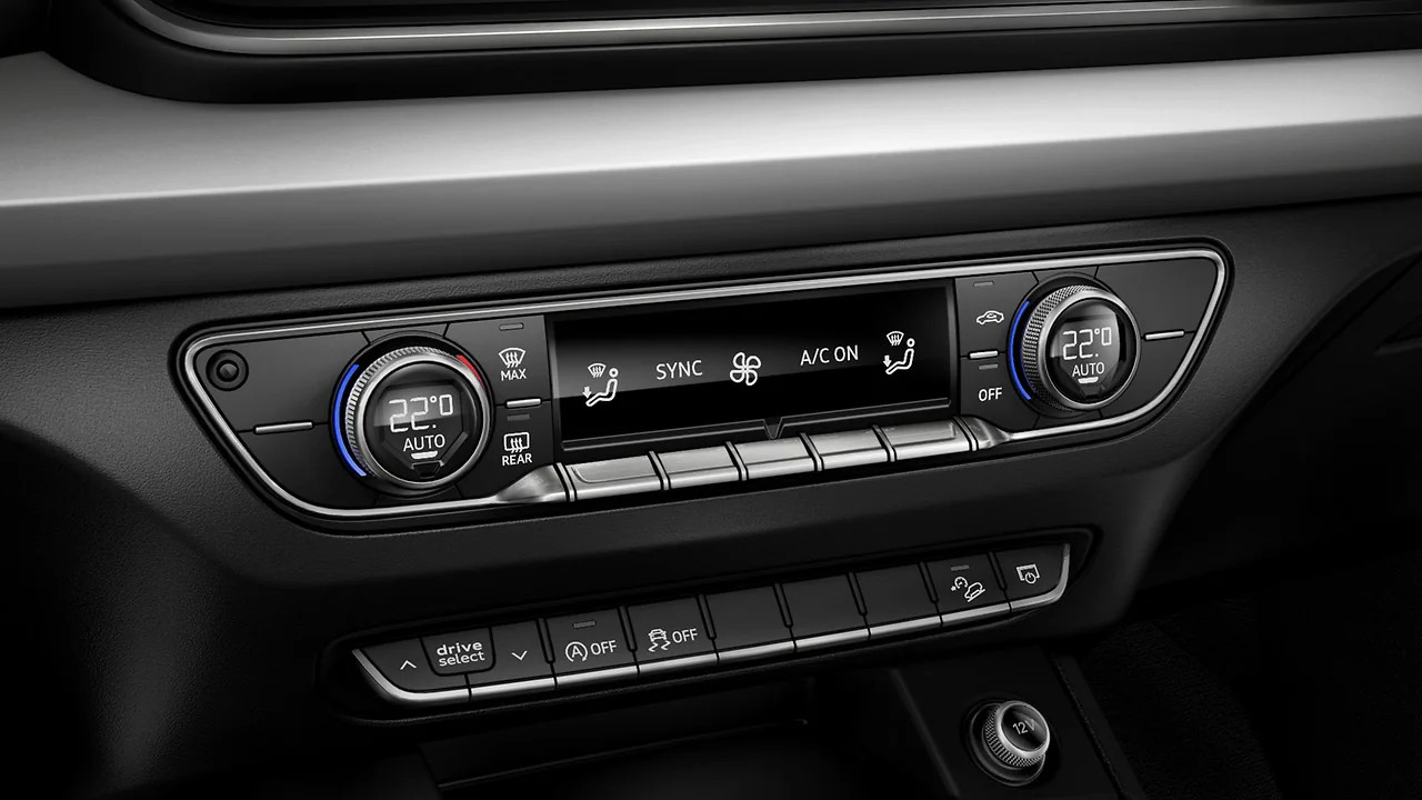 Audi Q5 — Three-zone automatic climate control panel with Drive Select buttons.