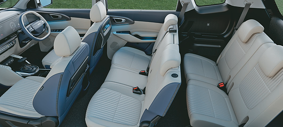 Kia Carens Clavis, Three-row cabin with dual-tone beige and navy leatherette upholstery