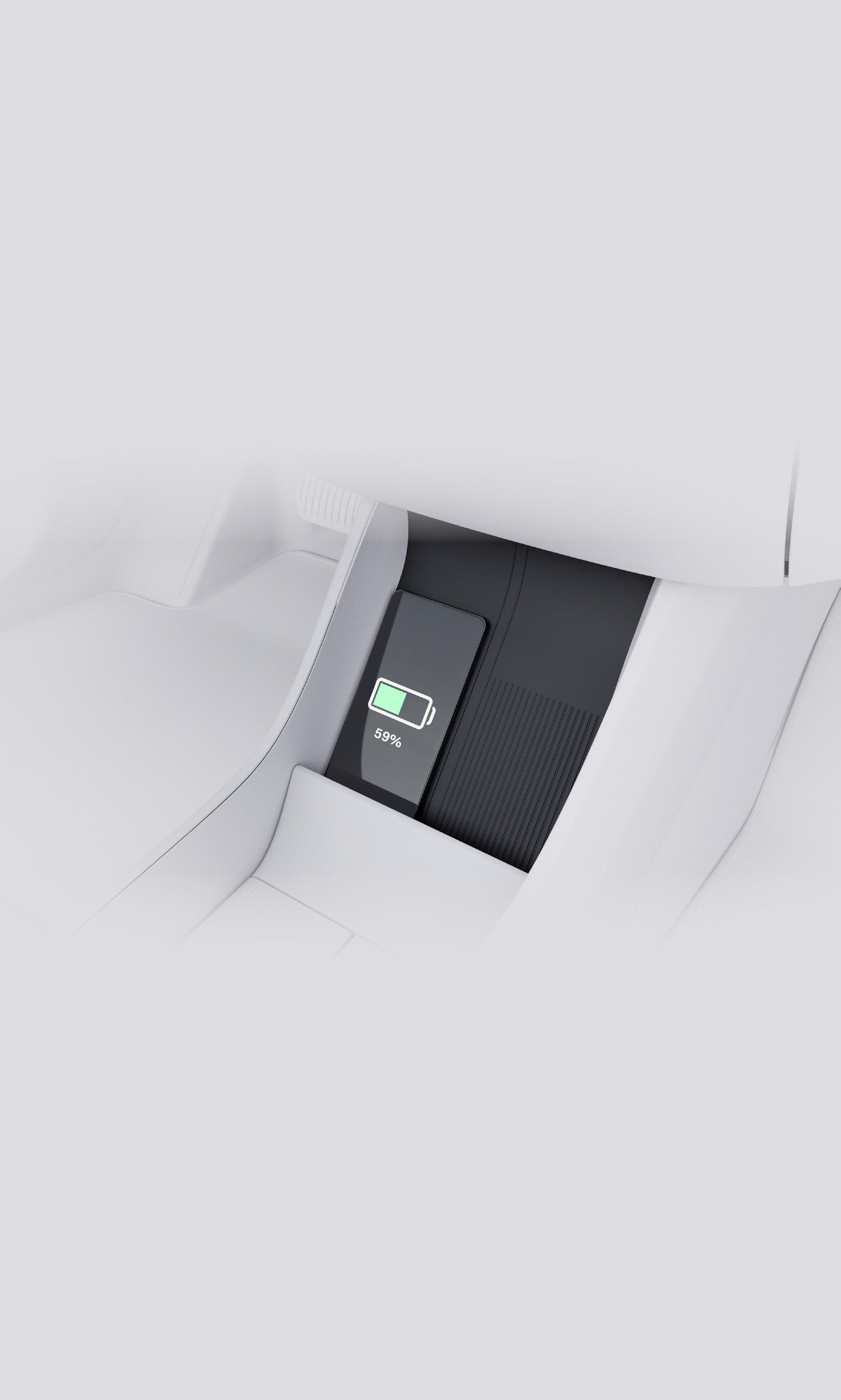 Volvo EX30 — Rear-console wireless charging pad shown charging a smartphone.