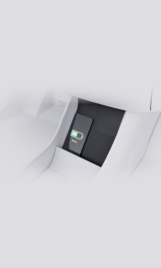 Volvo EX30, Rear-console wireless charging pad shown charging a smartphone.