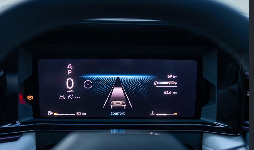 Digital instrument cluster displaying vehicle speed, navigation, and driving mode information.
