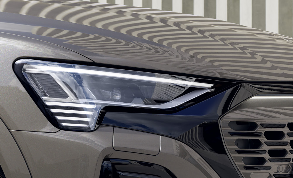 Audi Q8 e-tron — Digital Matrix LED headlight with the distinctive four-segment daytime running light signature.