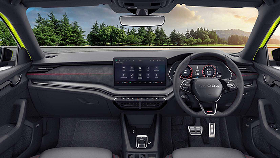 Skoda Octavia RS, Driver-focused RS cockpit with Suedia dashboard pad and red contrast stitching.