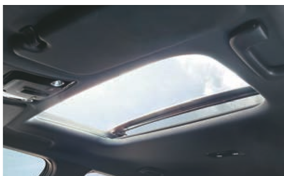 Kia EV6, Wide electric sunroof opening the cabin to the sky.