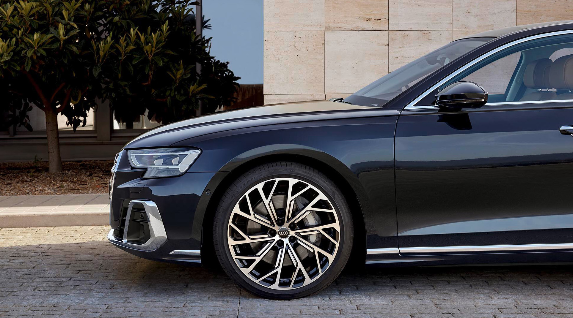 Audi A8 L — Machined 21-inch alloy wheel and LED headlight detail on the front wing