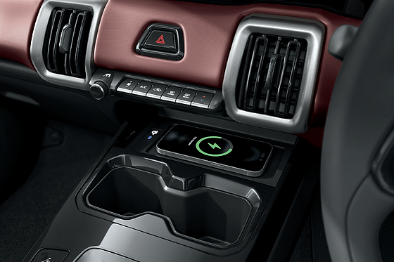 Maruti Suzuki e Vitara, Wireless smartphone charging pad in the centre console ahead of the cupholders.