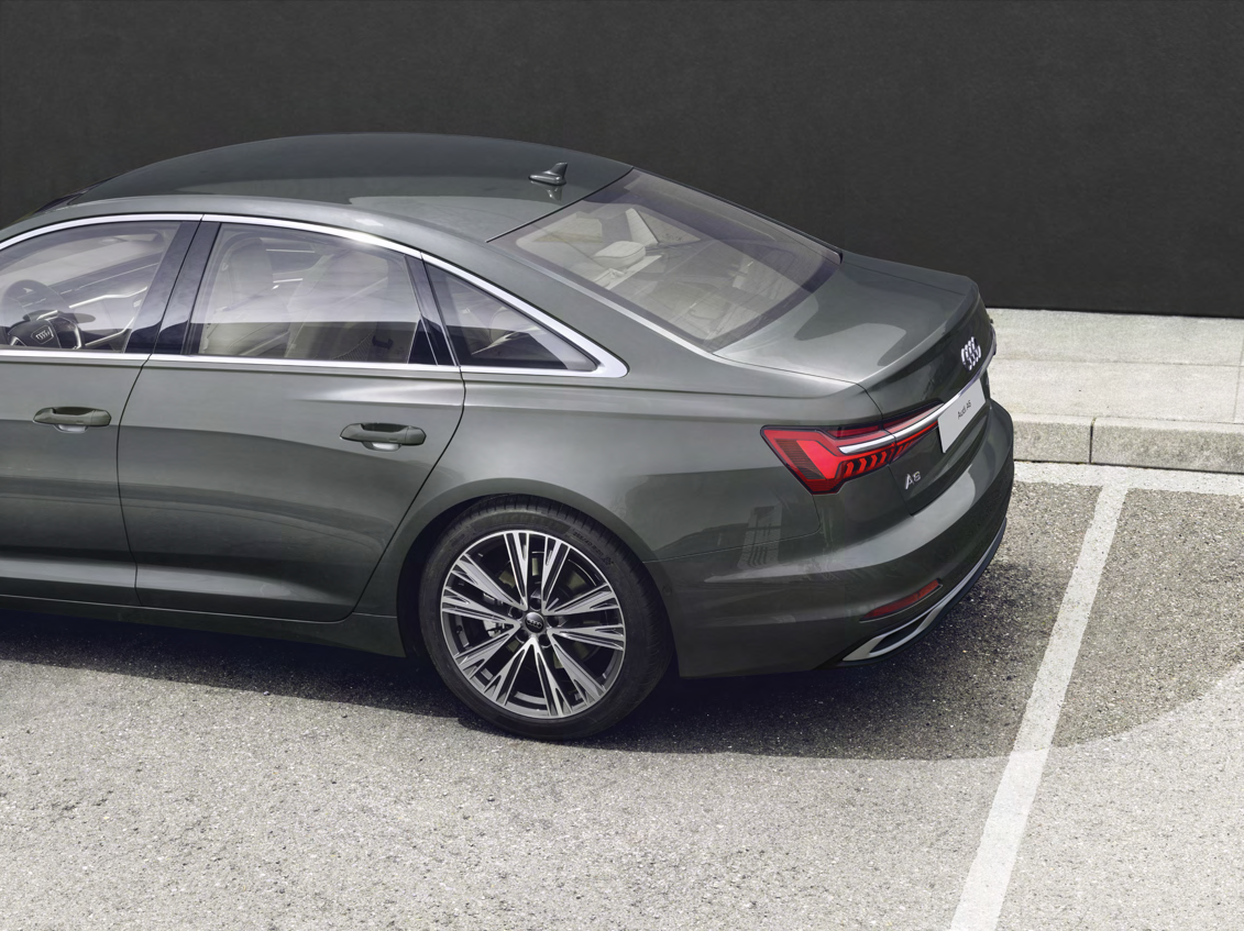 Audi A6 — 5-double-spoke diamond-turned alloy wheel with connected LED rear light detail