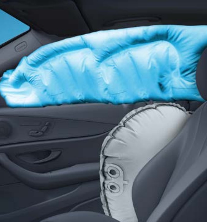 Mercedes-Benz EQS — Deployed side and window airbags shielding occupants in a side impact