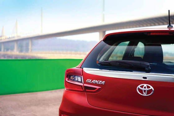 Toyota Glanza (2022-2026), LED tail lamps flanking the Glanza badge, with a rear wiper on the sloping tailgate.