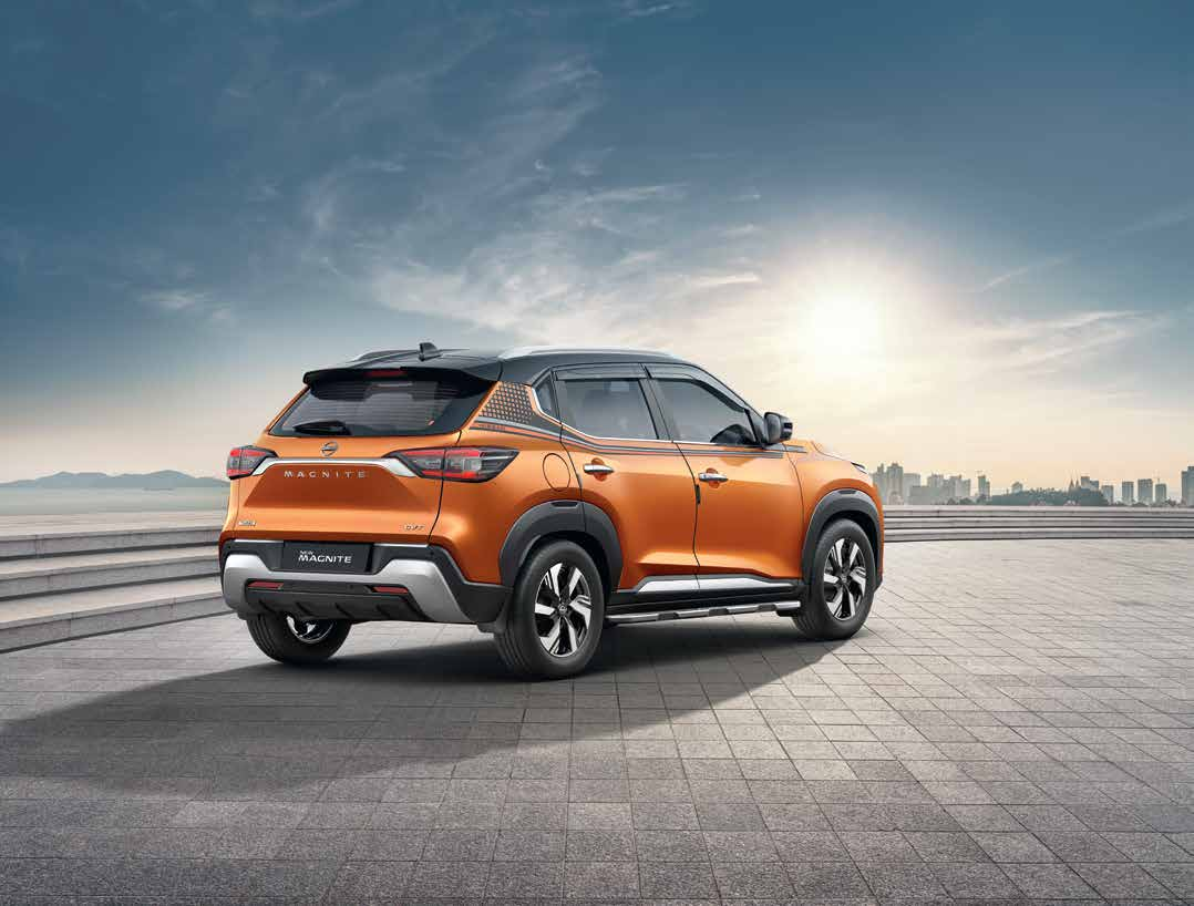 Nissan Magnite — Rear profile with wraparound LED tail lamps, roof spoiler and dual-tone roof.