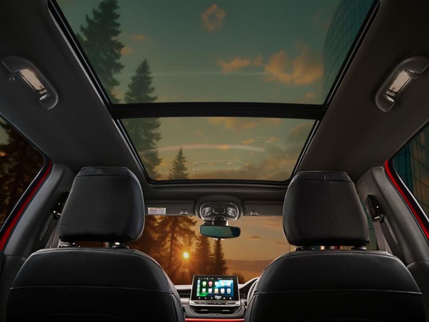 Jeep Compass — Dual-pane panoramic sunroof flooding the cabin with light.