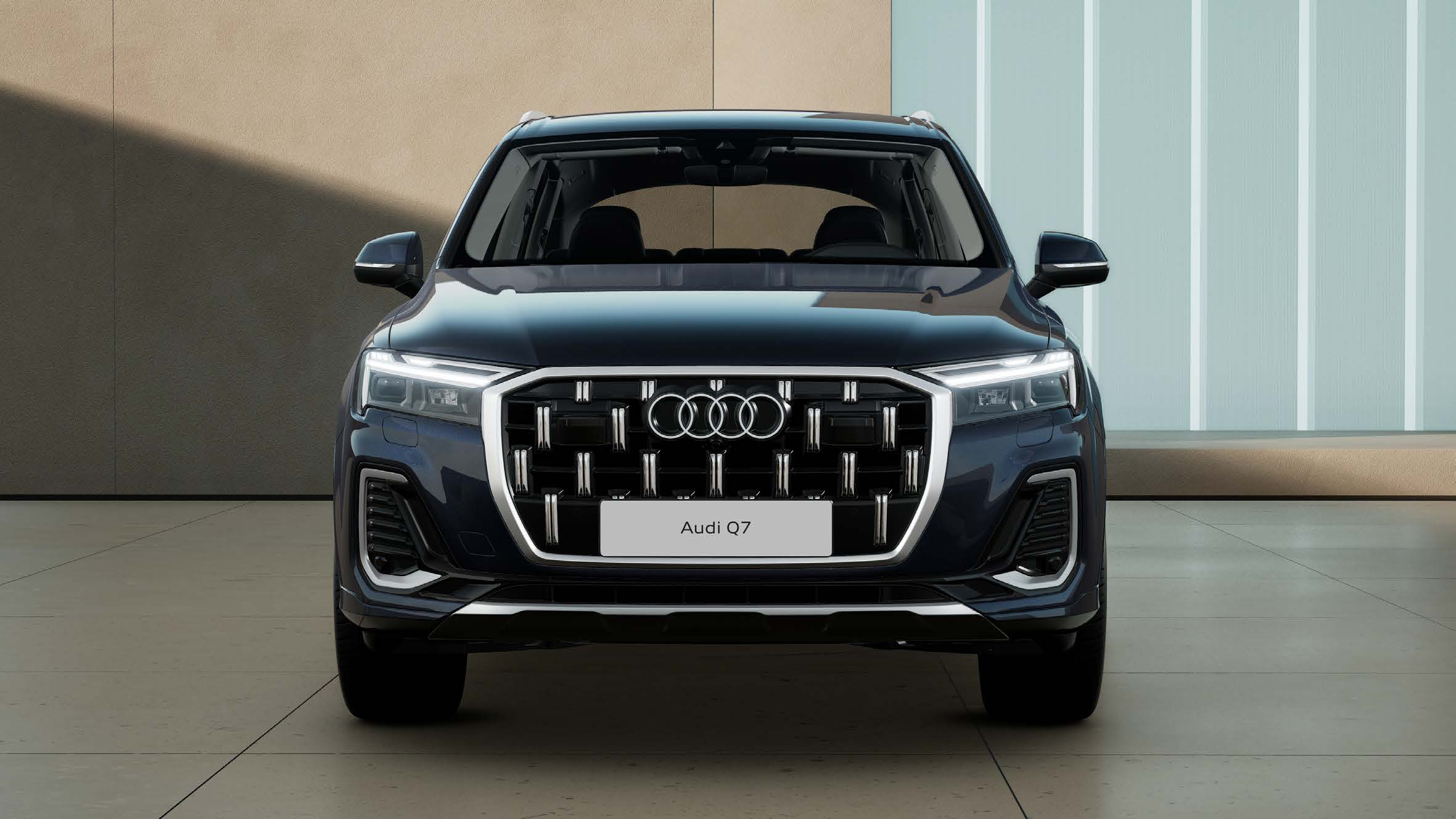 Audi Q7 — Bold octagonal Singleframe grille flanked by slim LED headlights defines the Q7's front