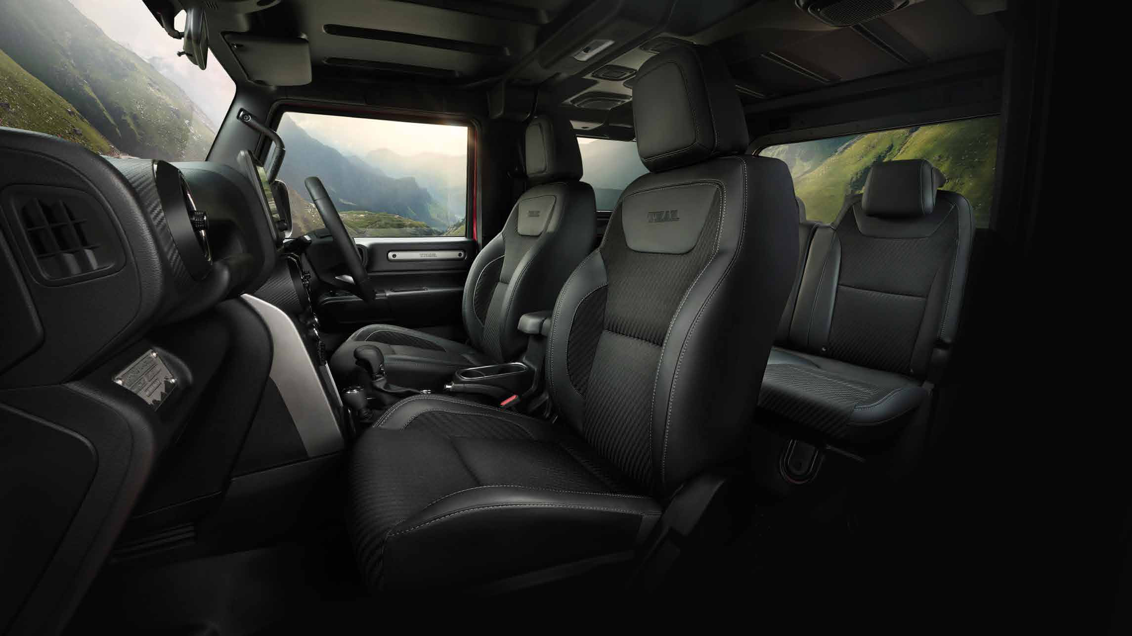 Mahindra Thar — Body-hugging front seats with height-adjustable driver seat and 50:50 front-facing rear seats