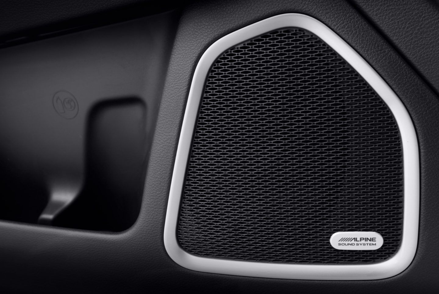 Jeep Meridian — Door-mounted speaker with an Alpine sound-system badge.