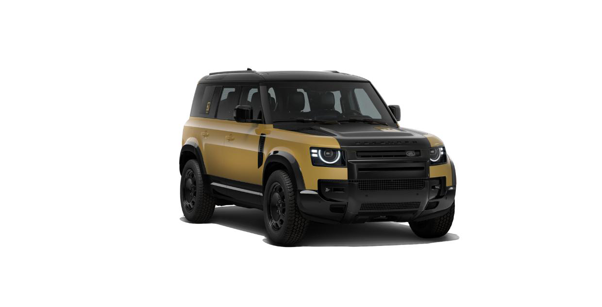 Land Rover Defender — Defender 110 Trophy Edition in Sandglow Yellow with gloss black bonnet, blacked-out grille and rugged black steel-look wheels on all-terrain tyres.