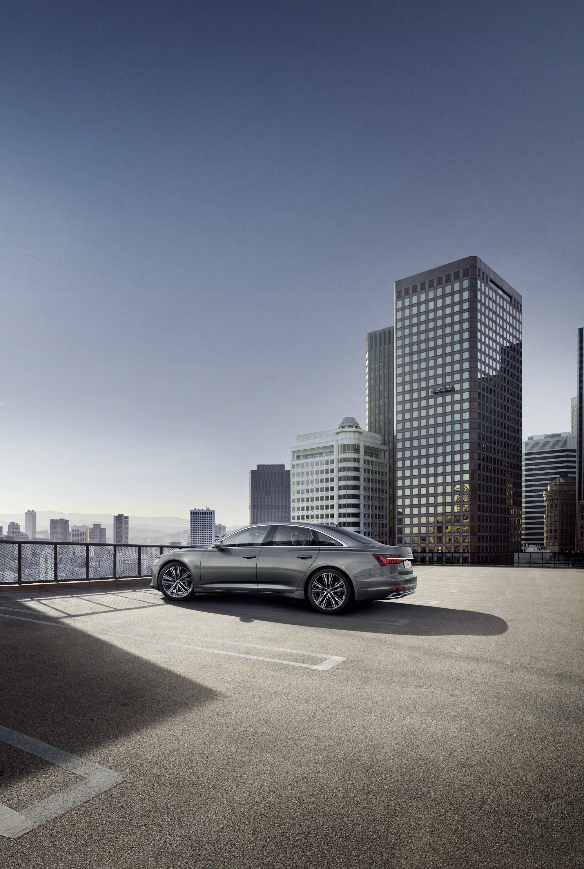 Audi A6 — Side profile highlighting the long bonnet, sloping roofline and flared wheel arches