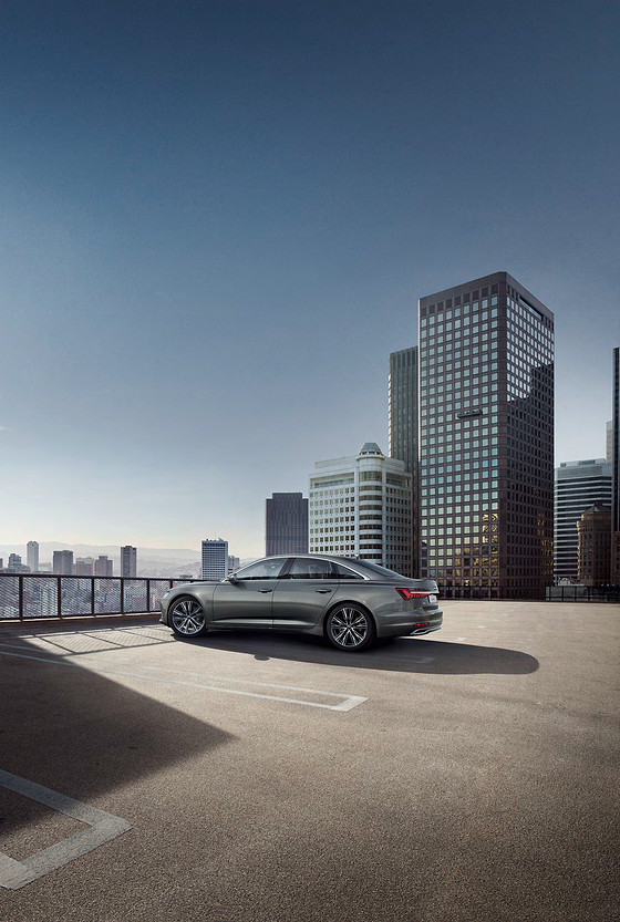 Audi A6, Side profile highlighting the long bonnet, sloping roofline and flared wheel arches